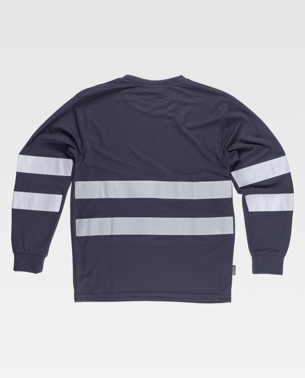 Miliar Ropa Laboral Camiseta de manga larga en poliéster ojo de perdiz con cintas reflectantes. Cuello redondo con cubrecosturas interior. Dos cintas reflectantes en pecho, espalda y mangas. Puño elástico. Tejido fresco y ligero de alta permeabilidad al aire. Transpirable, de fácil secado y resistente al encogimiento.